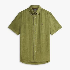 Olive green short-sleeve button-down shirt with white buttons and a small left-chest flag logo.
