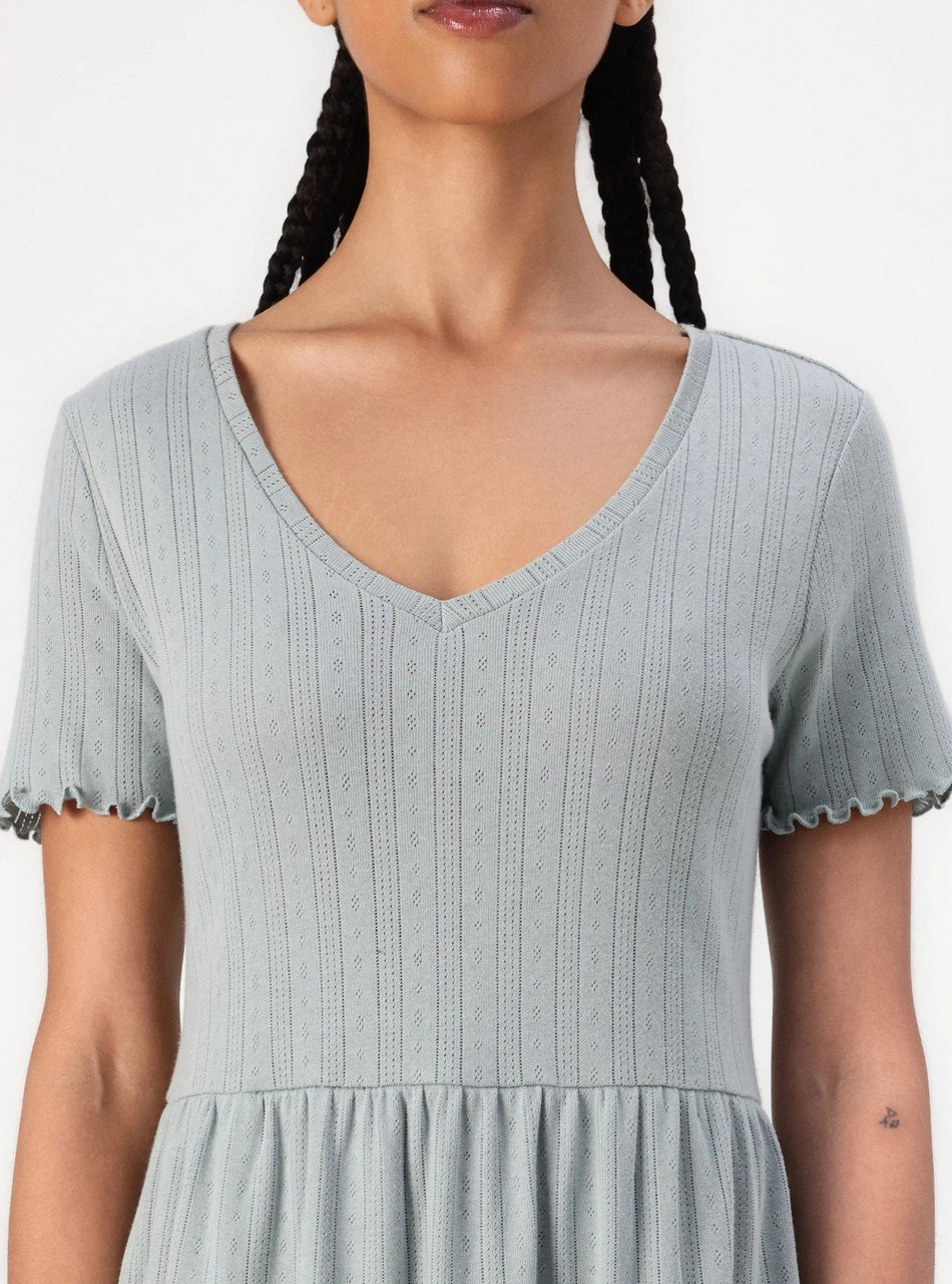 Light blue knit dress with a V-neck, short ruffled sleeves, and a gathered waist.