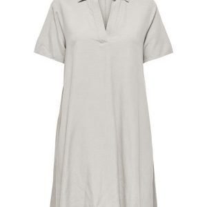 Light beige, knee-length linen dress with short sleeves, a collar, and a V-neck placket.