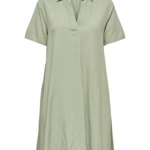 Loose sage green short-sleeve shirt dress with a collar and V-neck opening, knee-length or midi-length.