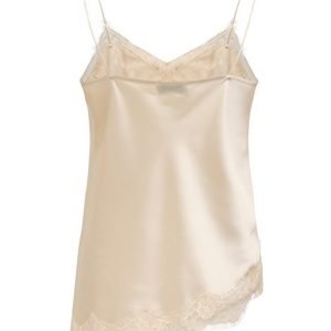 Beige satin slip dress with lace trim along the neckline and hem and thin spaghetti straps.