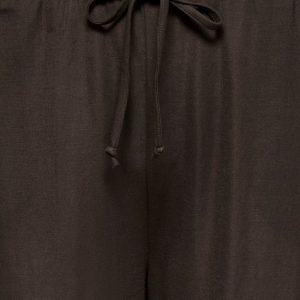 Close-up of a dark brown pant waist with a tied drawstring bow